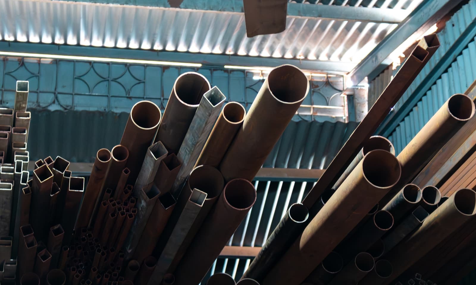 Racked steel pipe and square tubing stock ready for fabrication